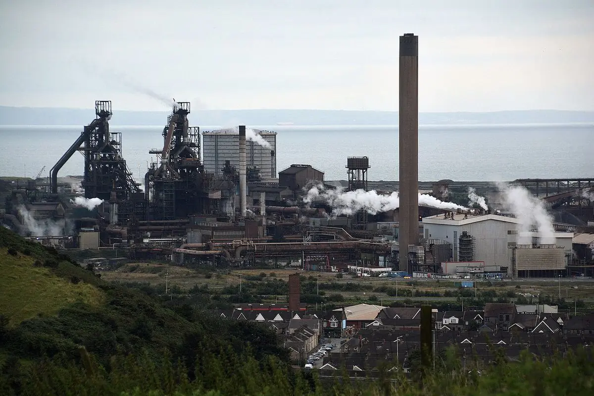 Port Talbot steelworks, its blast furnaces and chimney, seen from the hillside