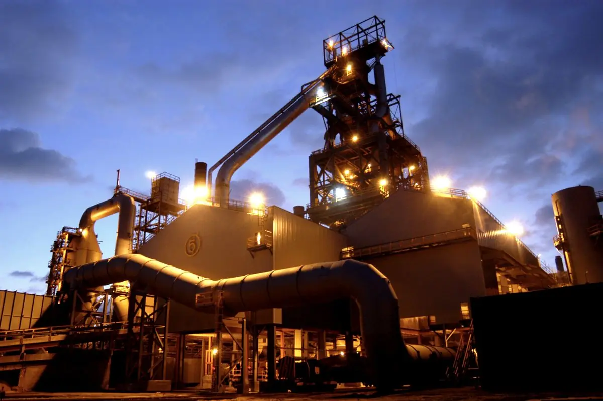 Number 5 blast furnace at Port Talbot steelworks, lit up at dusk