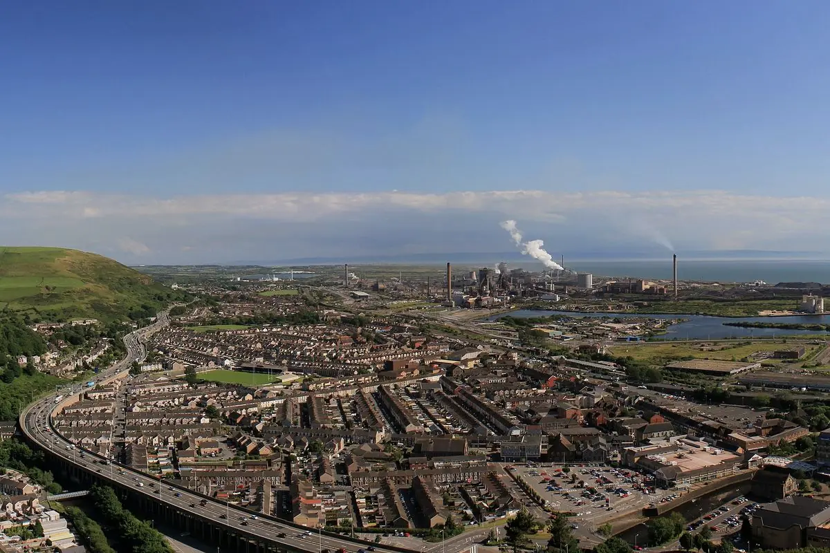 Port Talbot and the curve of Swansea Bay, seen from the hillside above the town